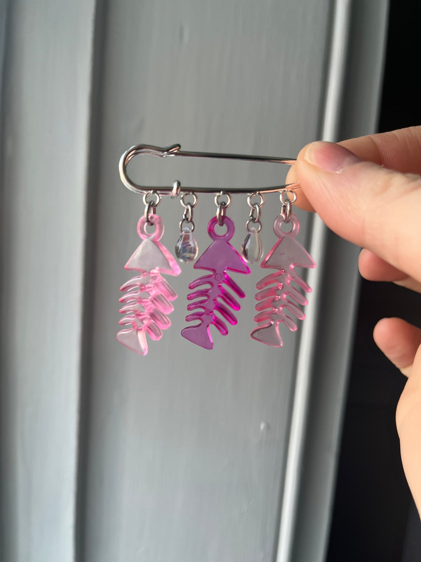 Pink fish charm pin