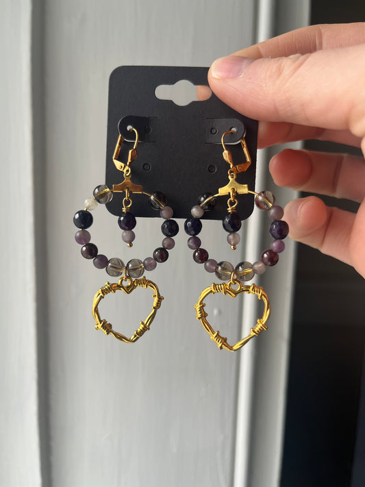 Purple barbed heart earrings
